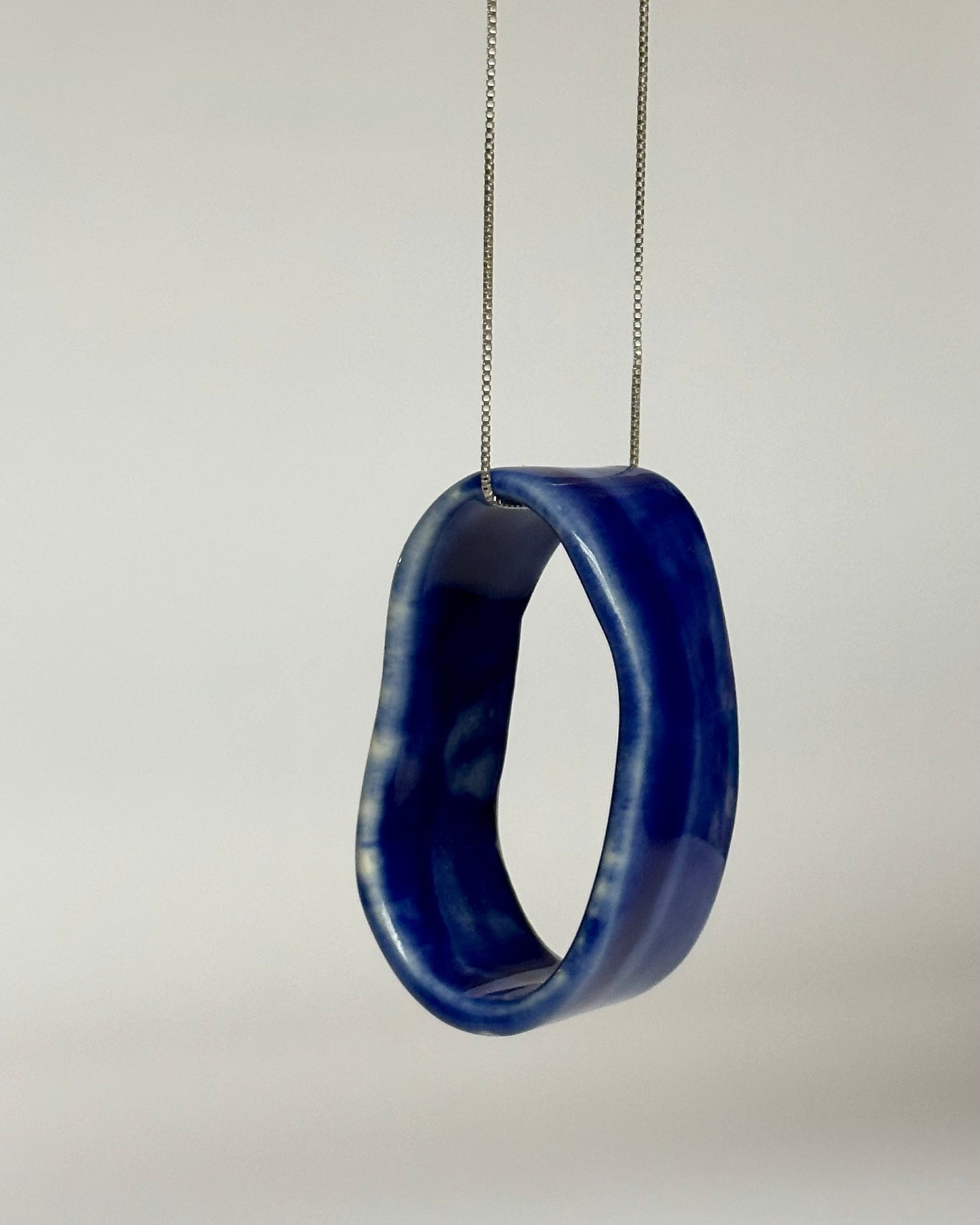 Porcelain Pendant Necklace "Circular". One Blue