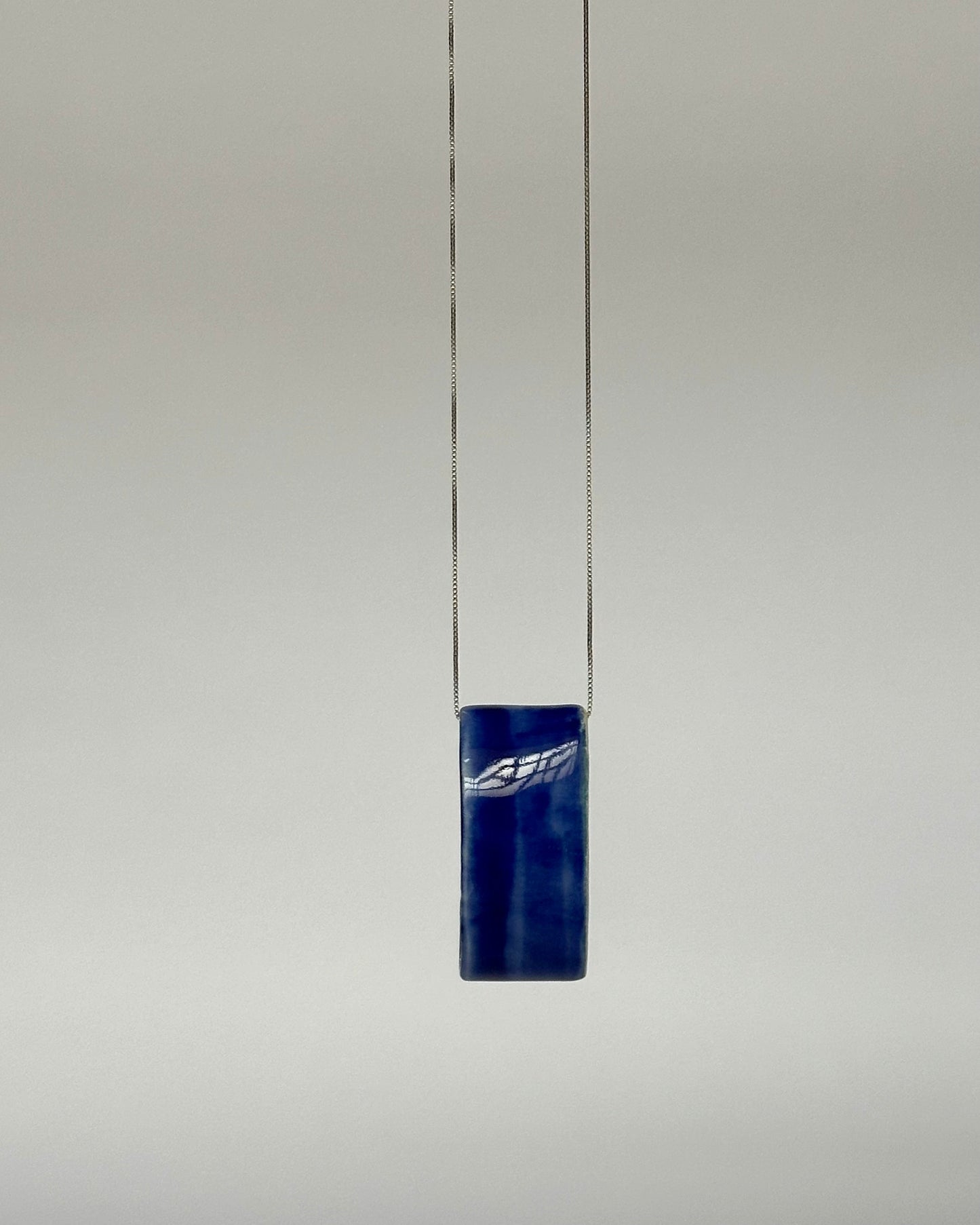 Porcelain Pendant Necklace "Circular". One Blue