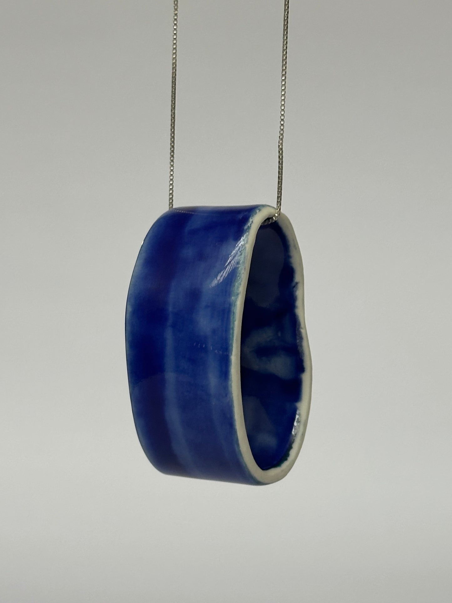 Porcelain Pendant Necklace "Circular". One Blue